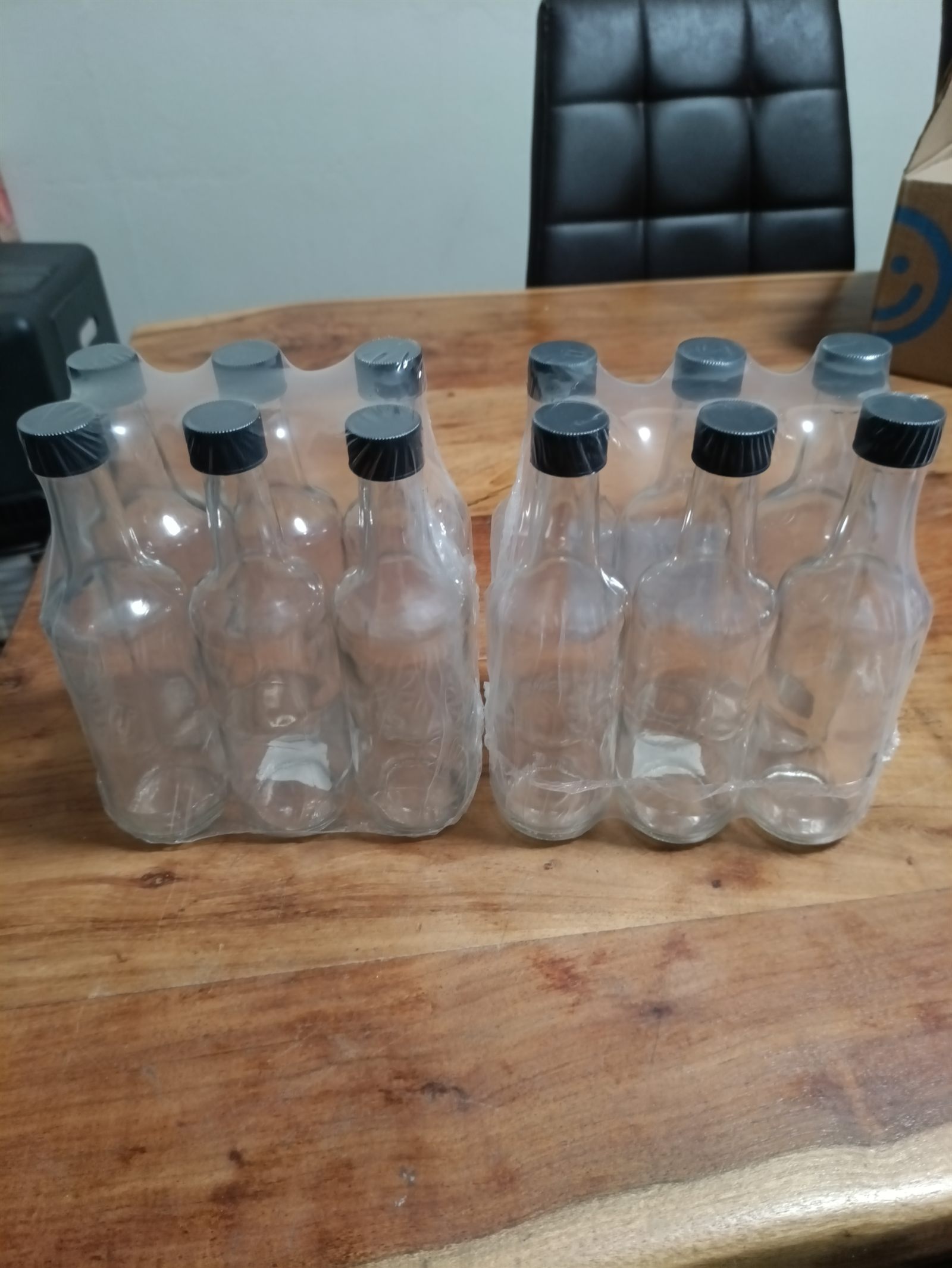 24-pack of empty 250ml glass bottles with black caps